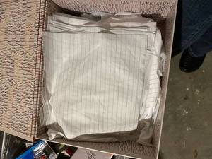 lot 144 image: Box full of precut squares of fabric for projects