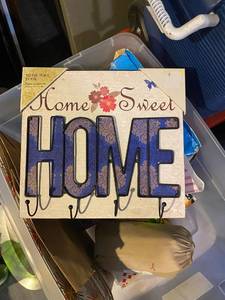 lot 317 image: Tote with home decor, games, picture frames etc.
