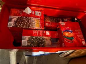lot 290 image: Tote of Christmas lights for house, bushes, and blow up Santa