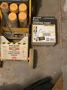 lot 244 image: Paintsprayer with several cans of paint (17) yellow, (7) white