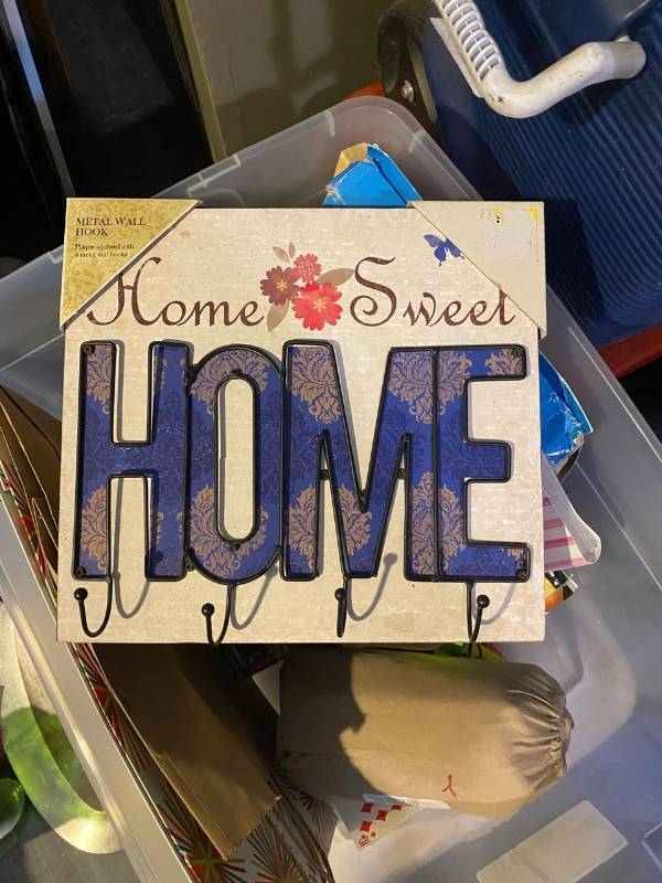 lot 317 image: Tote with home decor, games, picture frames etc.