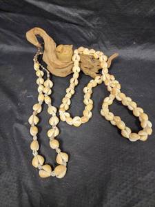 lot 499 image: 2 Cowrie Shell Necklaces, Stone Carved Bird and Small Piece of Driftwood