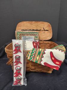 lot 604 image: Vintage Picnic Basket with Southwest Design Placemats, Napkins and Napkin Rings .