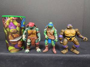 lot 27 image: Teenage Mutant Ninja Turtles Movie Action Figure Set with Collector Cup