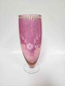 lot 57 image: Vintage Cranberry Glass Vase with Etched Floral Designs.