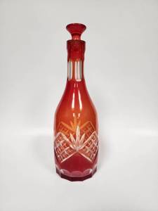 lot 61 image: Vintage Orange Diamond Cut Czech Bohemian Crystal Glass Decanter with Stopper to clear glass decanter, likely of Czech or Bohemian origin.