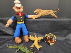 lot 69 image: Vintage Popeye Plush Doll with Animal Figurines and Puzzle Cube Collection