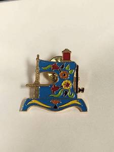 lot 75 image: Vintage Sewing Machine Enamel Pin - Garfield Collection 1940