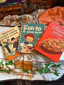 lot 7531 image: Vintage cookbooks and aprons