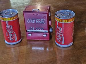 lot 7699 image: Vintage Coca-Cola Golf Ball Cans & Ice Cold Dispenser Set