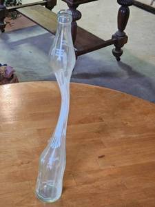 lot 7704 image: Vintage Elongated Clear Glass Bottle - 16 FL OZ