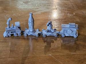 lot 7712 image: Vintage Coca-Cola Pewter Train Set