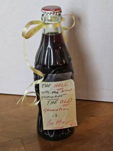 lot 7739 image: Vintage Coca-Cola Bottle with Handwritten Note