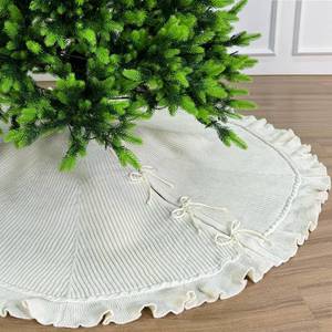 lot 1333 image: A 60-Inch Ruffled Sweater Knit Christmas Tree Skirt with Lace Ties, Cream White