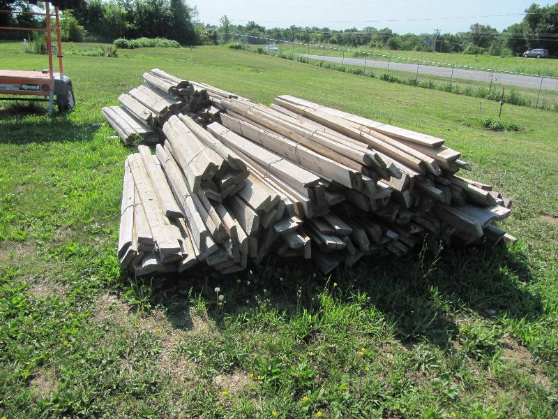 lot 321 image: APPROX. 30 BUNDLES APPROX 12 IN EACH BUNDLE OF 8 FOOT LENGTH BY 5 IN  WIDTH BY 2 IN HALF ROUND TIMBER