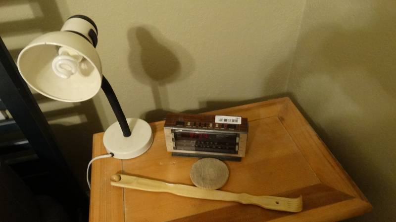 lot 787 image: Clock lamp back scratcher