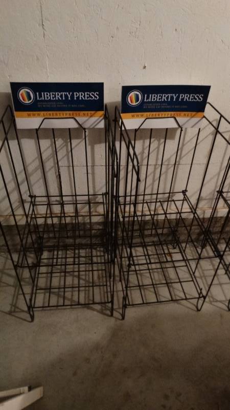 lot 811 image: 2 folding Liberty Press magazine racks