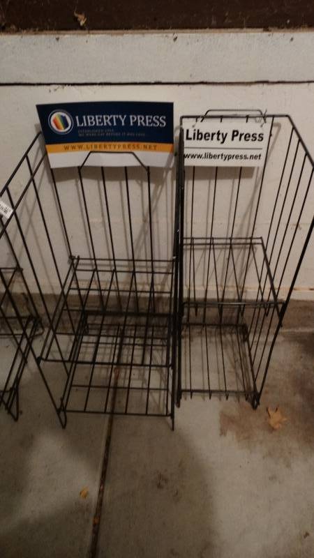 lot 813 image: 2 folding Liberty Press magazine racks