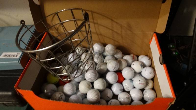 lot 829 image: Box of golf balls & metal golf ball bucket