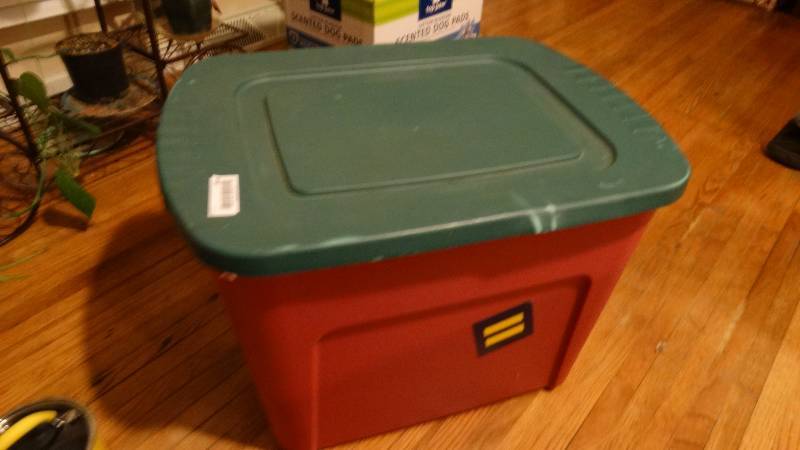 lot 849 image: Plastic storage tote w Equality stickers on it