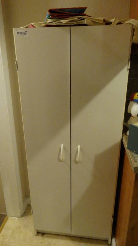 lot 858 image: 2 door white storage cabinet w bags