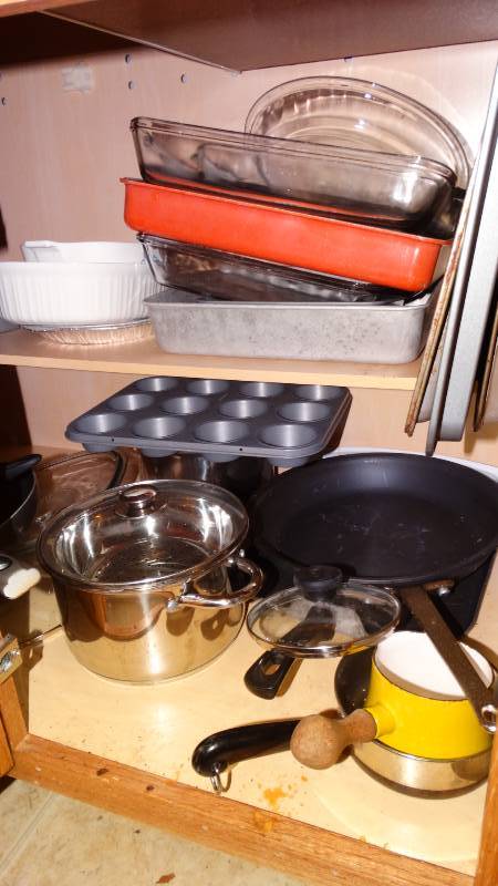lot 877 image: Cabinet w assorted baking pans pots pans misc.