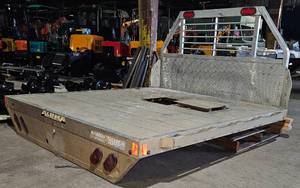 lot 1268 image: ALUMA FLATBED For Truck, ALL ALUMINUM Construction, Rub Rail with Stake Pockets, Lighted Headache Rack, Tail Lights, Back-Up Lights, Extruded Aluminum Floor with Drop Rear Skirt, 3 Channel Main Stringers - Adjustable to Fit Different Truck Models