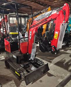 lot 1437 image: UNUSED MIVA VA13 1-TON MINI EXCAVATOR. 13.5HP ENGINE, 37 WIDE, 7 TRACKS, MECHANICAL THUMB, ELECTRIC KEY START, PUSH BLADE, JOYSTICK CONTROLS, AUX HYDRAULICS, 360 DEGREE ROTATE. WEIGHS 2200lbs. COMES WITH 16 BUCKET LIFT CAPACITY IS 900LBS