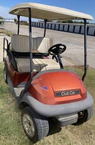 lot 1295 image: Very Nice Club Car w Charger - Four (4) Passenger Body Molded Comfort Front Seat & Fold Down Rear Seat - Batteries are 6 Months Old - Four (4) New Tires Have Been Added Since the Pics Were Taken