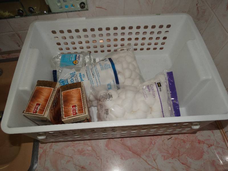 lot 2026 image: Storage Tub, Cotton balls, Hair Color, & all items in drawer & shelves underneath.