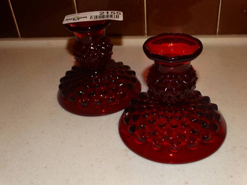 lot 2155 image: Fenton Ruby Red Hobnail Short Candlesticks - Pair.