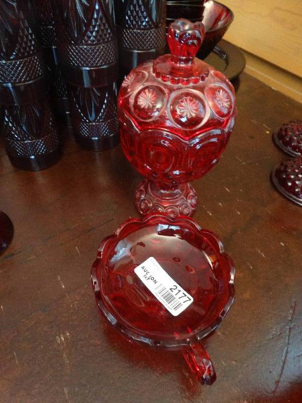 lot 2177 image: Ruby Red Coin Glass Fingertip Dish, & Ruby Glass Moon & Stars Lidded Candy Jar.