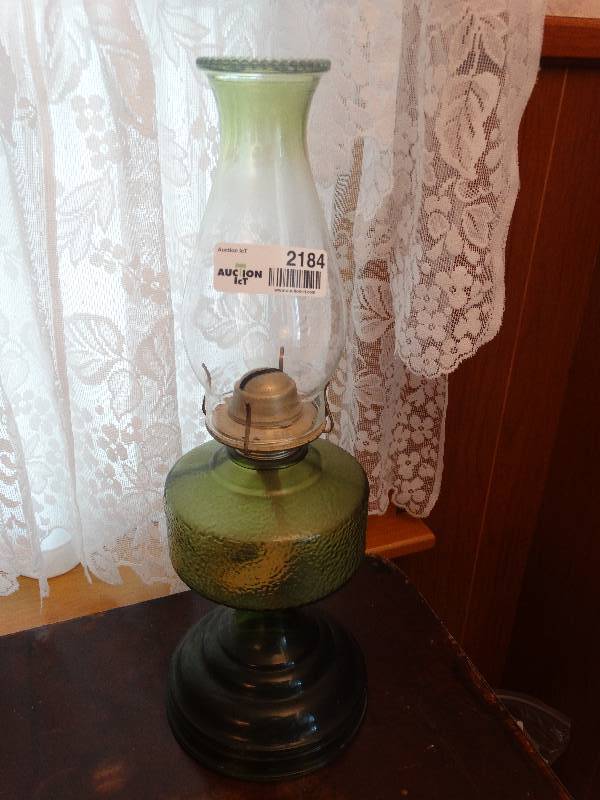 lot 2184 image: Green Glass Oil Lamp.