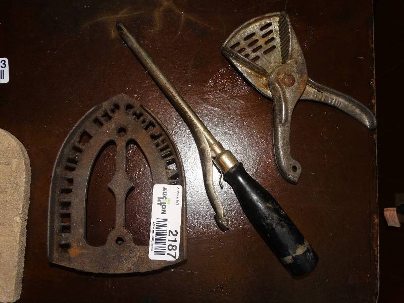 lot 2187 image: Vintage Iron Stand, Antique Hair Curling Wand, & LemonLime Juicer.