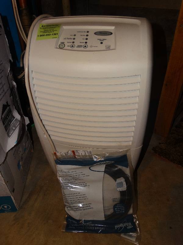 lot 2263 image: Whirlpool Gold Dehumidifier & Extra Drain Tube.