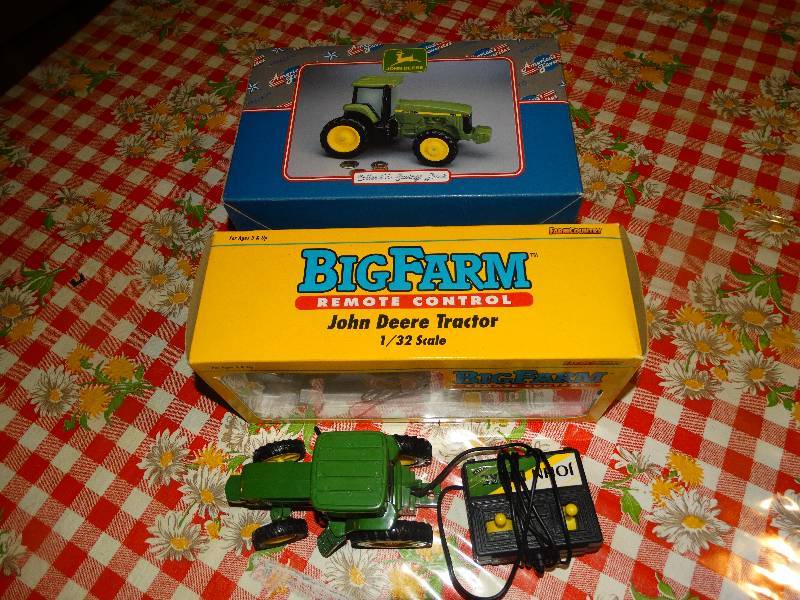 lot 2268 image: Big Farm Remote Control John Deere Tractor & a John Deere Tractor Bank.