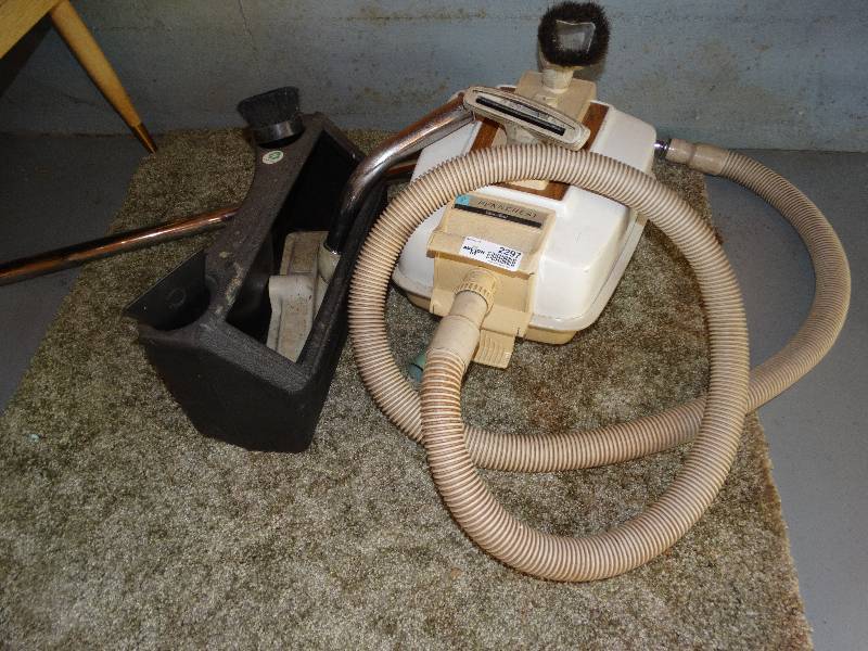 lot 2297 image: Penncrest Canister Vacuum & Attachments. 14 pcs. of Carpet Remnant & Rugs.