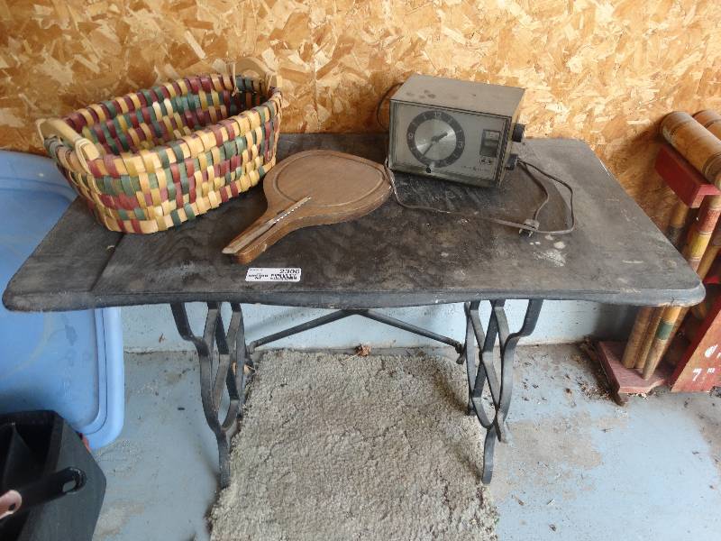 lot 2306 image: Table made from Old Treadle Sewing Machine Legs, Basket, Cheese Board, ClockRadio.
