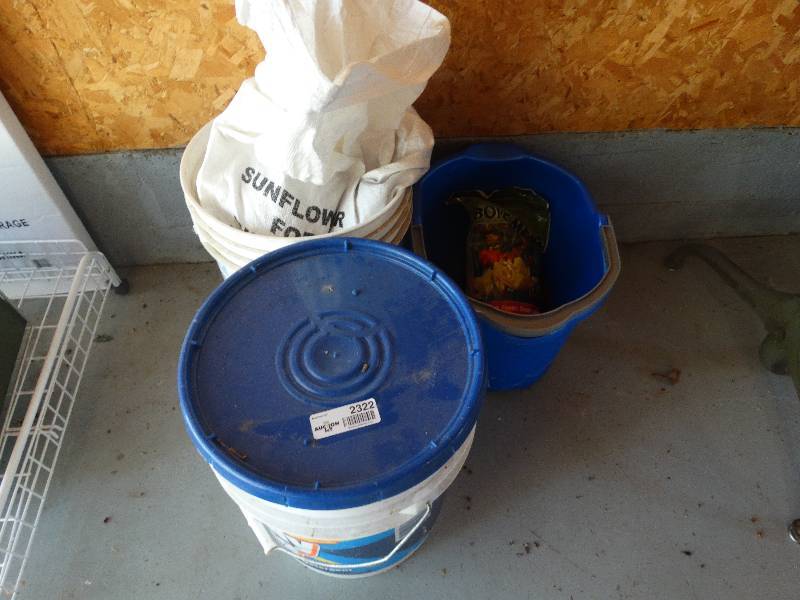 lot 2322 image: Bucket wOil Spill Powder, Sunflower Bird Feeder Seed, Wash Bucket & Bag of  Bone Meal.