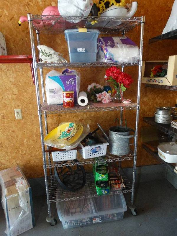 lot 2329 image: Metal Shelf Rack wContents - Leaf Scoops, Candles, Planter Basket, Pop, Tub wRugs, Flowers, Paper Goods, Christmas & Yard Decor.