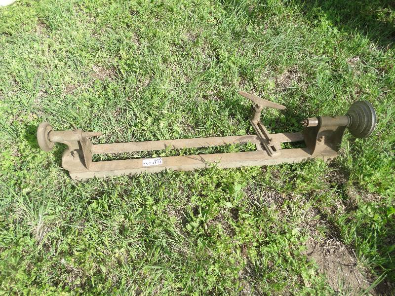 lot 2386 image: Old metal belt driven wood lathe