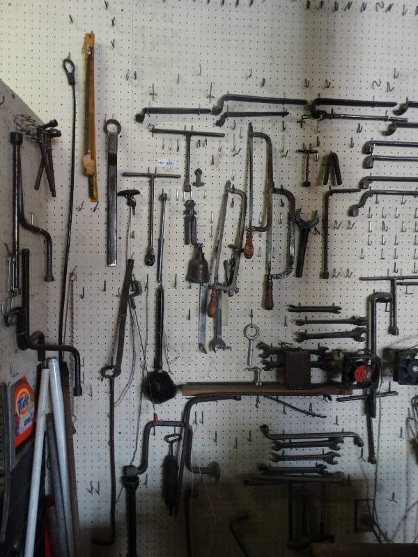 lot 3111 image: Contents of peg board. wrenches, tirre irons, and other hand tools. hats not included.