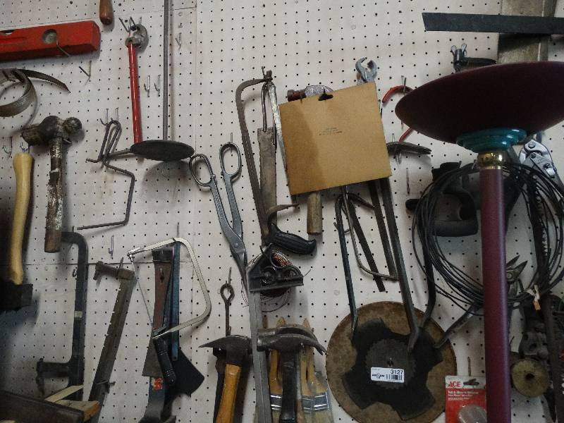 lot 3127 image: Contents of peg board.  hand tools, saws, lamp, cords, air hose and more.