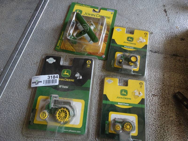 lot 3184 image: 3 John deere tractors and plane.