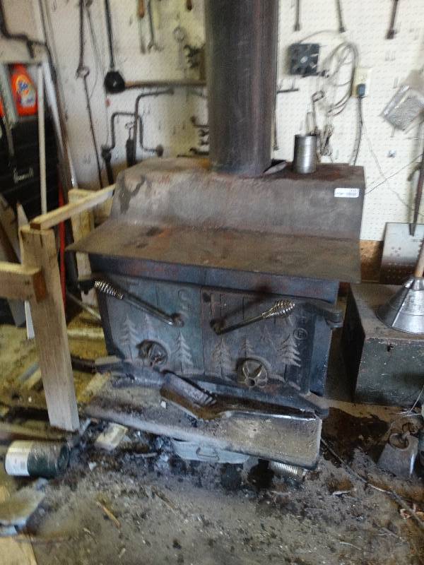 lot 3191 image: Fisher wood burning stove. Must be taken apart and removed by buyer.
