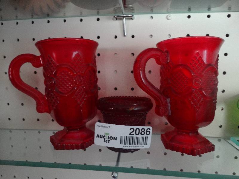 lot 2086 image: 2 Glass cups and a tooth pick holder