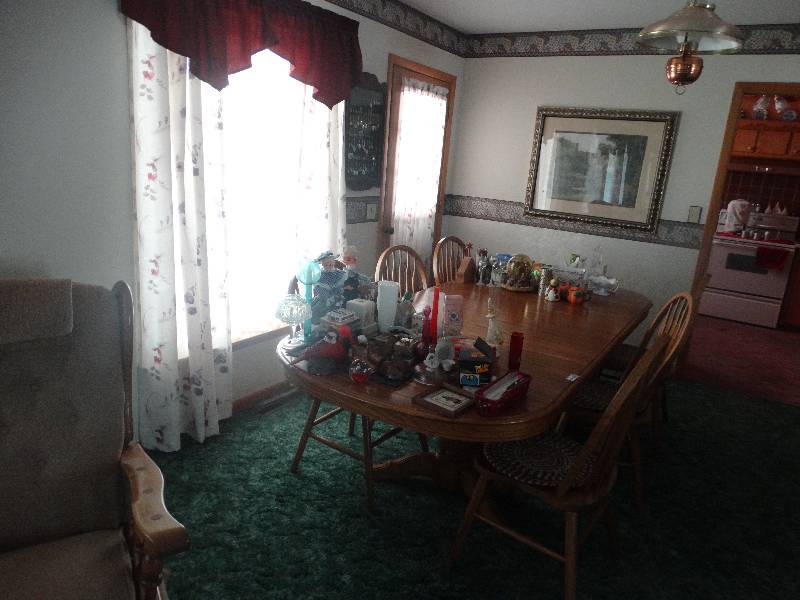 lot 2108 image: Wood dinning room table with 2 leafs and 6 matching chairs. No contents.