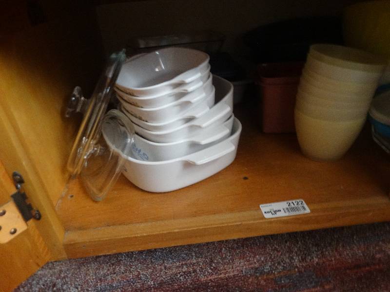 lot 2122 image: Contents of bottom shelf of cabinet.