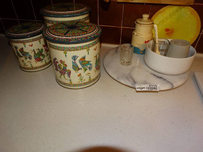lot 2119 image: Marble turn table with contents on top, metal canister set.