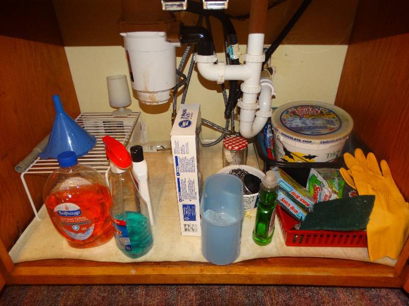 lot 2125 image: Contents of cabinet under & next to sink